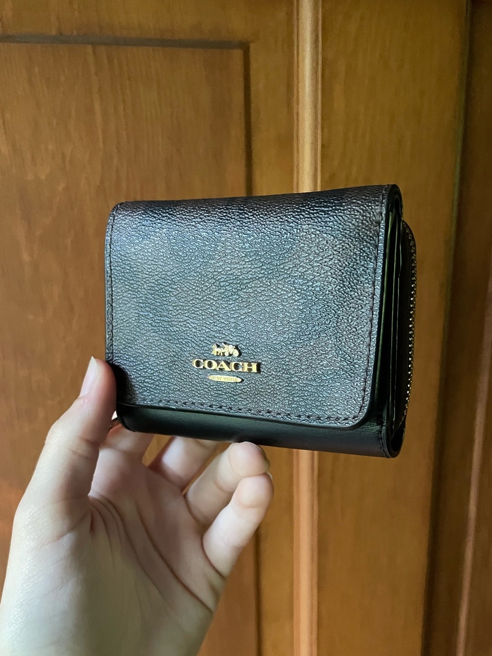 Coach Signature Small Compact Tri-Fold Wallet in black and brown signature print